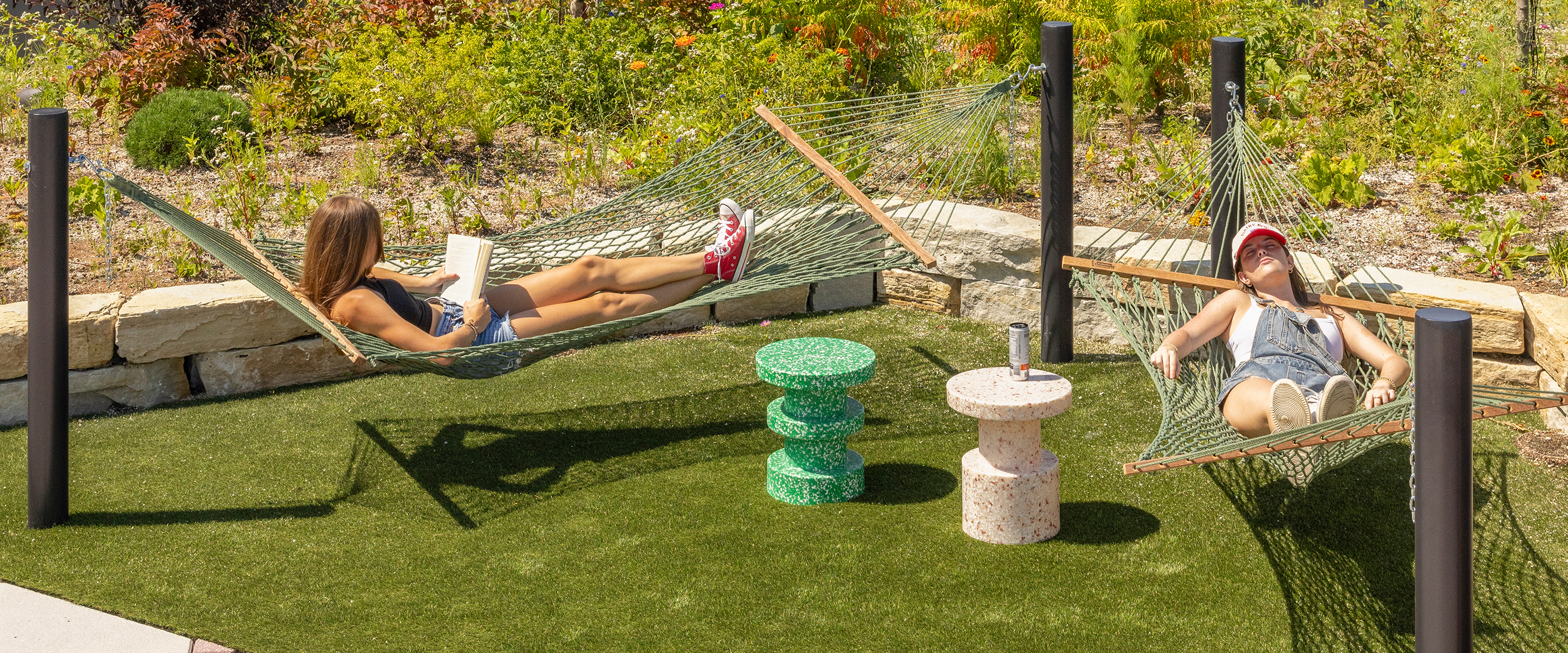 Two friends relaxing in hammocks